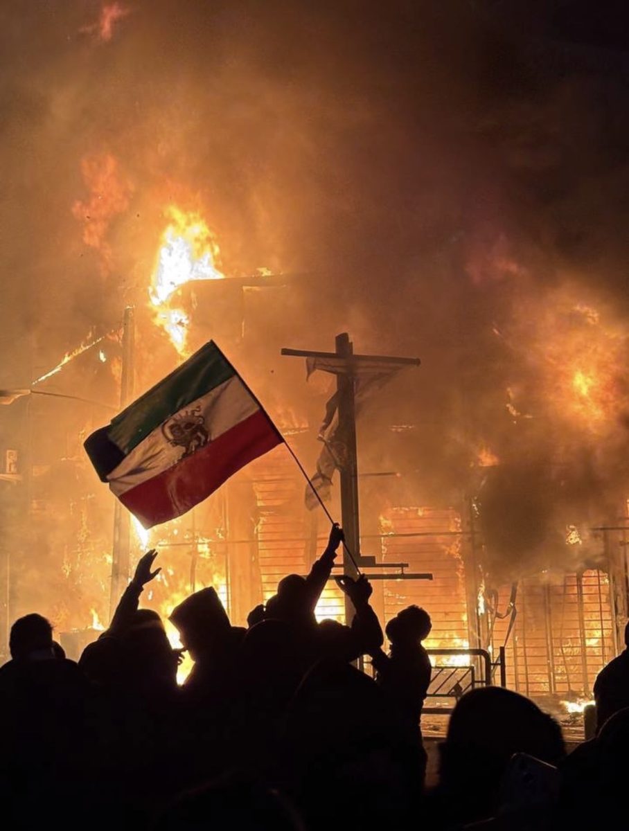 A building burns down in a protest at Tehran, Iran. (Courtesy of @azadehakba on Instagram)