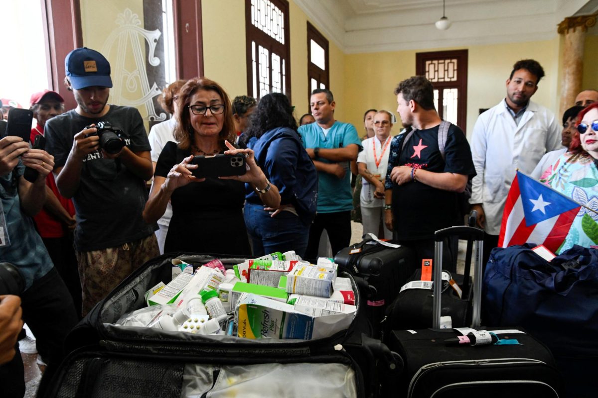 Activists from a convoy bringing humanitarian aid show a suitcase with donated medicine in Havana, Cuba, March 21, 2026.