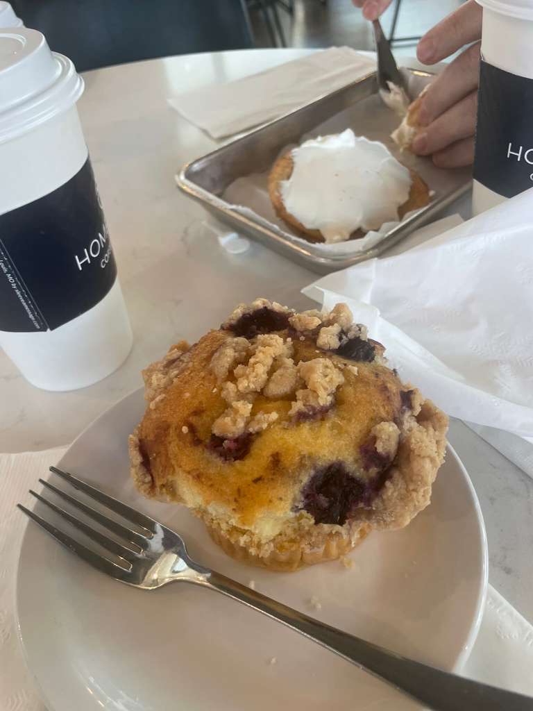 An LFA student orders a blueberry muffin at Lake Forest’s Hometown Coffee and Juice.