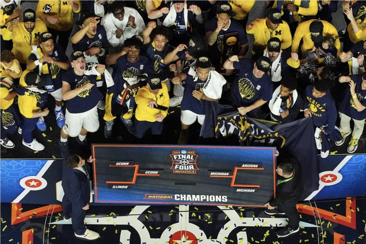The University of Michigan Men’s Basketball team celebrates winning the National Championship. (Courtesy of Reuters)