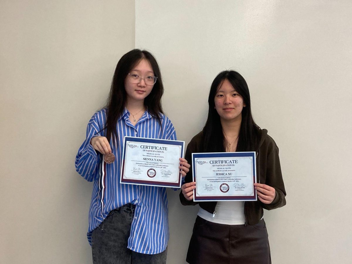 Sienna Yang’27 (left), holds her top-three state medal and certificate, and Jessica Xu’27 (right), holds her state qualification certificate.