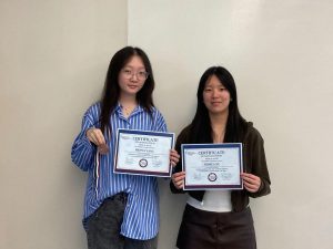 Sienna Yang’27 (left), holds her top-three state medal and certificate, and Jessica Xu’27 (right), holds her state qualification certificate.